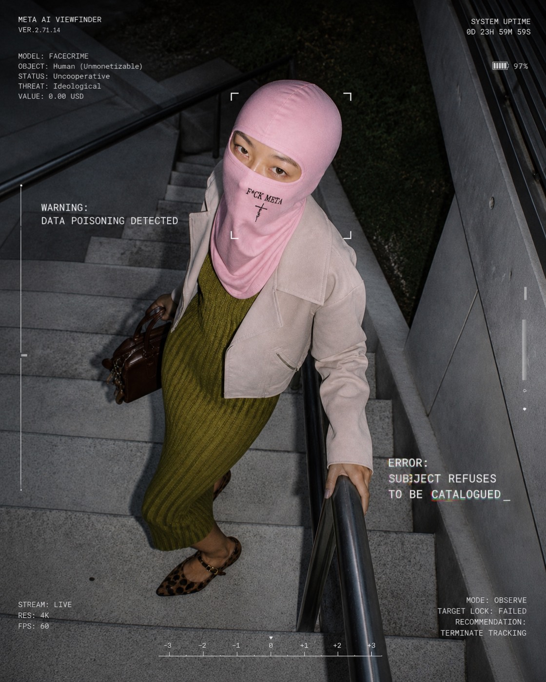 Surveillance-viewfinder mock-up: a model in the blush F*CK META balaclava on a stairwell, overlaid with the warning “data poisoning detected”.